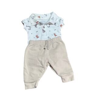 Sterling baby 2 piece polo bodysuit featuring dog prints and beige bottoms